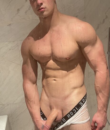 Muscle boy in the shower