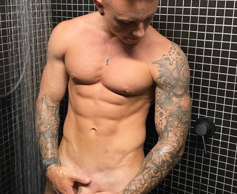 Muscle boy in the shower