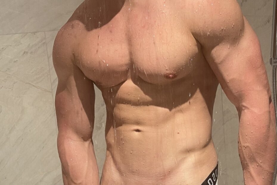 Muscle boy in the shower