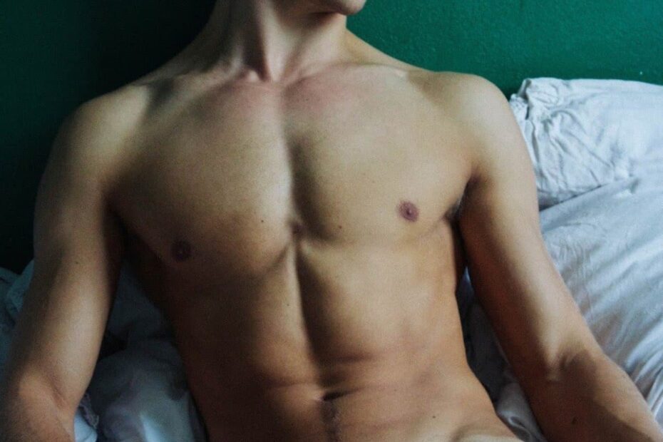 Nude muscle boy in bed